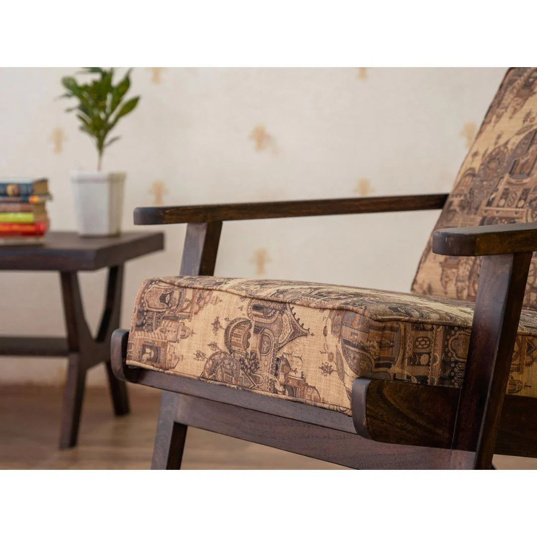 Wooden Chair with patterned cushion in a room setting with a table and plant.